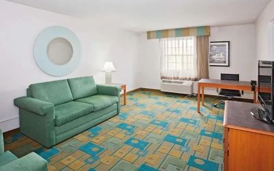 Day use suite's workspace and living area at Norwood Inn & Suites Merrillville.