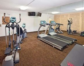 Well equipped fitness center at Norwood Inn & Suites Merrillville.