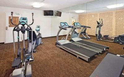 Well equipped fitness center at Norwood Inn & Suites Merrillville.