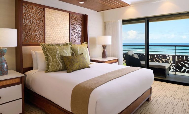 King bed at Ko'a Kea Resort On Po`ipu Beach.