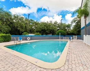 Outdoor pool at OYO Townhouse Orlando West.