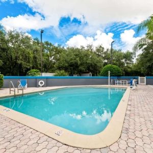 Outdoor pool at OYO Townhouse Orlando West.