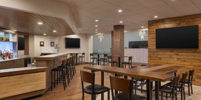 Coworking area and bar at DoubleTree By Hilton Fort Worth South.