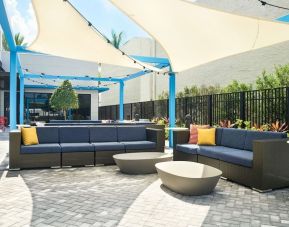 Outdoor seating at Tru By Hilton Ft. Lauderdale Airport.