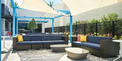 Outdoor seating at Tru By Hilton Ft. Lauderdale Airport.