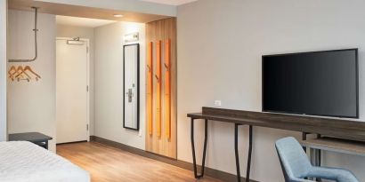 King room with TV at Tru By Hilton Ft. Lauderdale Airport.