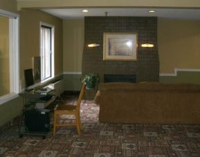 Lobby lounge and workspace at Norwood Inn & Suites - Roseville.
