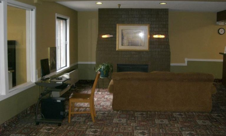 Lobby lounge and workspace at Norwood Inn & Suites - Roseville.