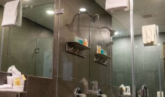 Private guest bathroom with shower and free toiletries at Hotel Chelsea, A South Beach Group Hotel.