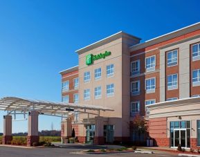 Hotel entrance and parking area at Holiday Inn Aurora North- Naperville.