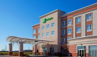 Hotel entrance and parking area at Holiday Inn Aurora North- Naperville.