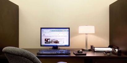 Business center with computer, printer and ergonomic chair at Hilton Orrington/Evanston.