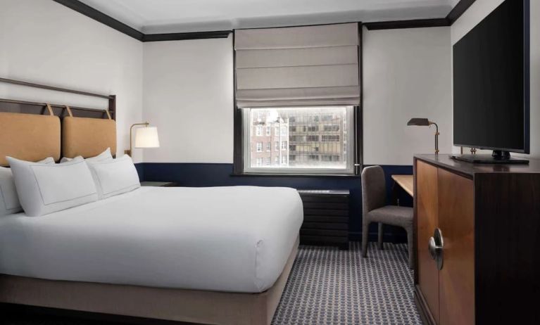 Standard room with work desk and TV screen at Hilton Orrington/Evanston.