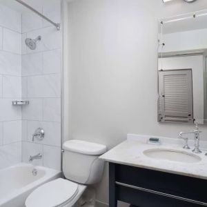 Private guest bathroom with combined tub and shower at Hilton Orrington/Evanston.