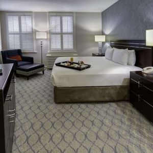 Bright and spacious day use room with work desk and sofa at Hilton Orrington/Evanston.