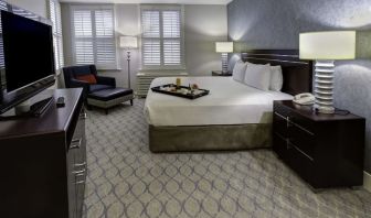 Bright and spacious day use room with work desk and sofa at Hilton Orrington/Evanston.