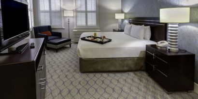 Bright and spacious day use room with work desk and sofa at Hilton Orrington/Evanston.