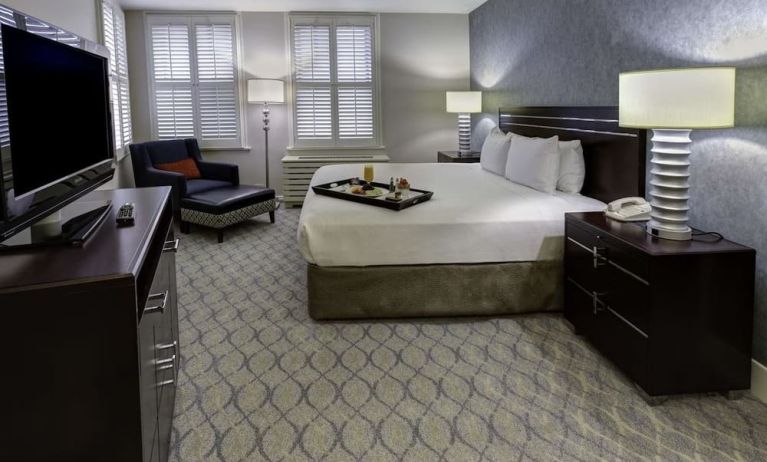 Bright and spacious day use room with work desk and sofa at Hilton Orrington/Evanston.