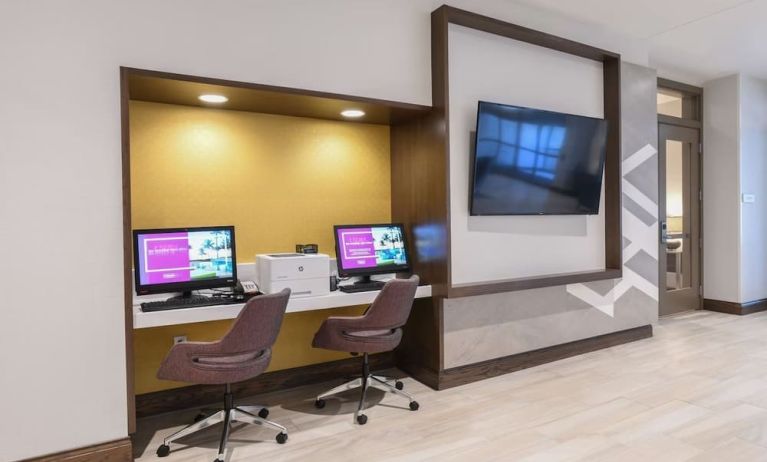 Business center with computers, printer and ergonomic chairs at Hilton Garden Inn Cincinnati Midtown.
