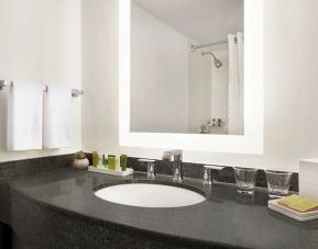 Private guest bathroom with shower and free toiletries at Hilton Scottsdale Resort & Villas.
