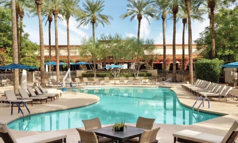 Outdoor pool and lounge chairs at Hilton Scottsdale Resort & Villas.