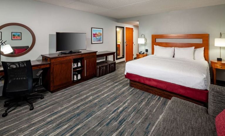 Day use room with king bed, work desk and private bathroom at Hampton Inn & Suites St. Louis At Forest Park.