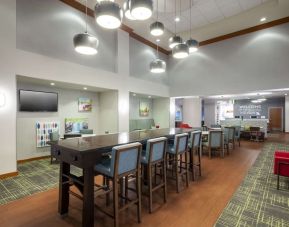 Lobby lounge and workspace at Hampton Inn & Suites St. Louis At Forest Park.