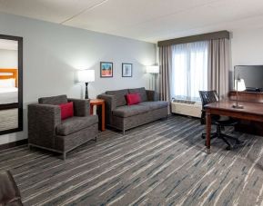 Day use room's workspace and lounge area at Hampton Inn & Suites St. Louis At Forest Park.