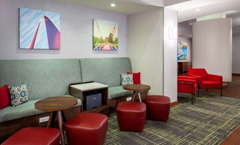 Lobby workspace with comfortable seating and printer at Hampton Inn & Suites St. Louis At Forest Park.