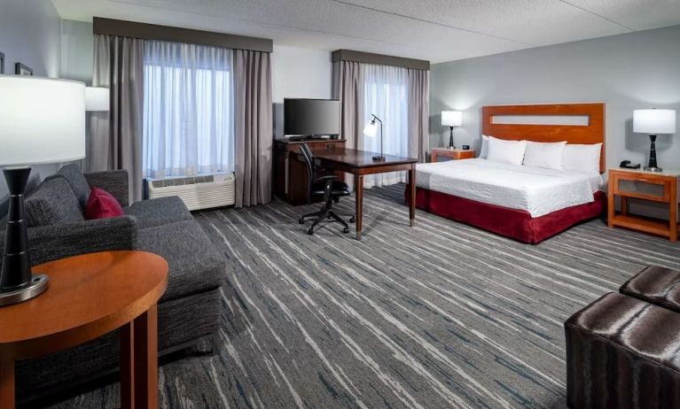 Day use room with king bed and workspace at Hampton Inn & Suites St. Louis At Forest Park.