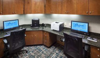Business center with computers, printer and ergonomic chairs at Hampton Inn Los Angeles-Orange County-Cypress.