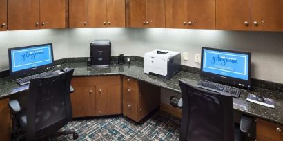 Business center with computers, printer and ergonomic chairs at Hampton Inn Los Angeles-Orange County-Cypress.