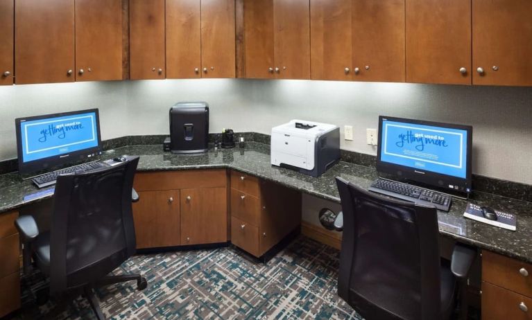 Business center with computers, printer and ergonomic chairs at Hampton Inn Los Angeles-Orange County-Cypress.