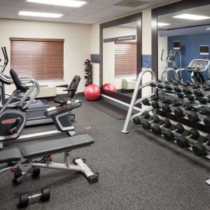 Fully equipped fitness center at Hampton Inn Los Angeles-Orange County-Cypress.