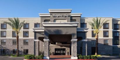 Entrance and parking area at Hampton Inn Los Angeles-Orange County-Cypress.