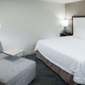 King bed and sofa at Hampton Inn Los Angeles-Orange County-Cypress.