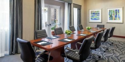Professional meeting room with ergonomic chairs at Homewood Suites By Hilton Agoura Hills.