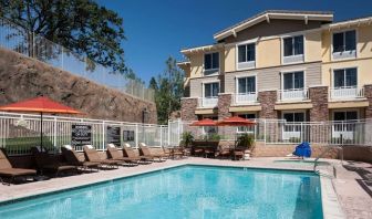 Outdoor pool with lounge chairs at Homewood Suites By Hilton Agoura Hills.