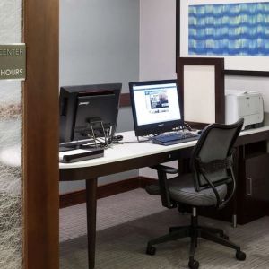 Business center with computers, printer and ergonomic chairs at Homewood Suites By Hilton Agoura Hills.