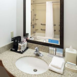 Private guest bathroom with combined shower and tub at Hampton Inn & Suites Clovis-Airport North.