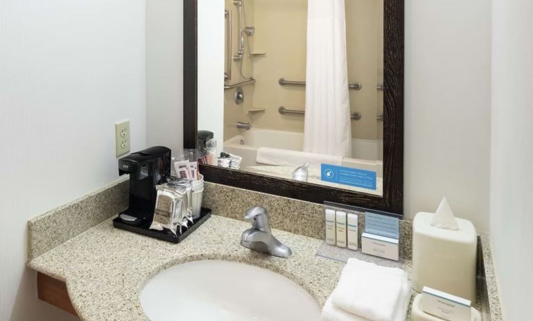 Private guest bathroom with combined shower and tub at Hampton Inn & Suites Clovis-Airport North.