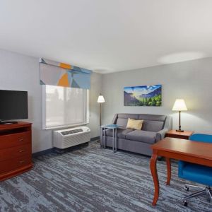 Day use suite with work desk and sofa at Hampton Inn & Suites Clovis-Airport North.