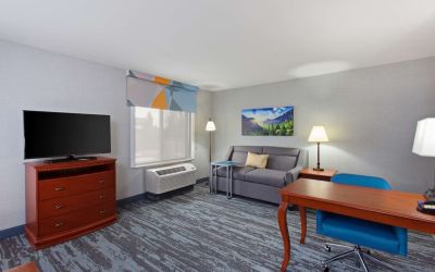 Day use suite with work desk and sofa at Hampton Inn & Suites Clovis-Airport North.