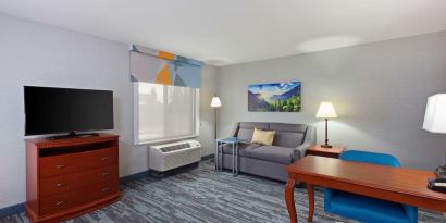 Day use suite with work desk and sofa at Hampton Inn & Suites Clovis-Airport North.
