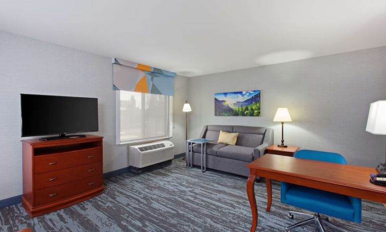 Day use suite with work desk and sofa at Hampton Inn & Suites Clovis-Airport North.