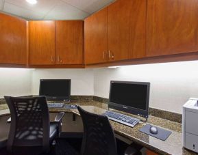 Business center with computers, printer and ergonomic chairs at Hampton Inn & Suites Clovis-Airport North.