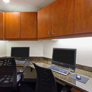 Business center with computers, printer and ergonomic chairs at Hampton Inn & Suites Clovis-Airport North.