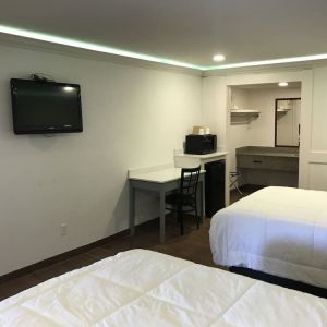 Queen beds with TV at Star Inn Hotel Sea World.