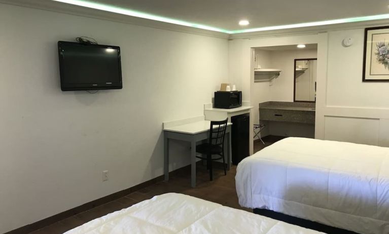 Queen beds with TV at Star Inn Hotel Sea World.
