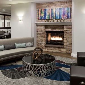 Lobby lounge with fireplace at Homewood Suites By Hilton San Jose Airport-Silicon Valley.